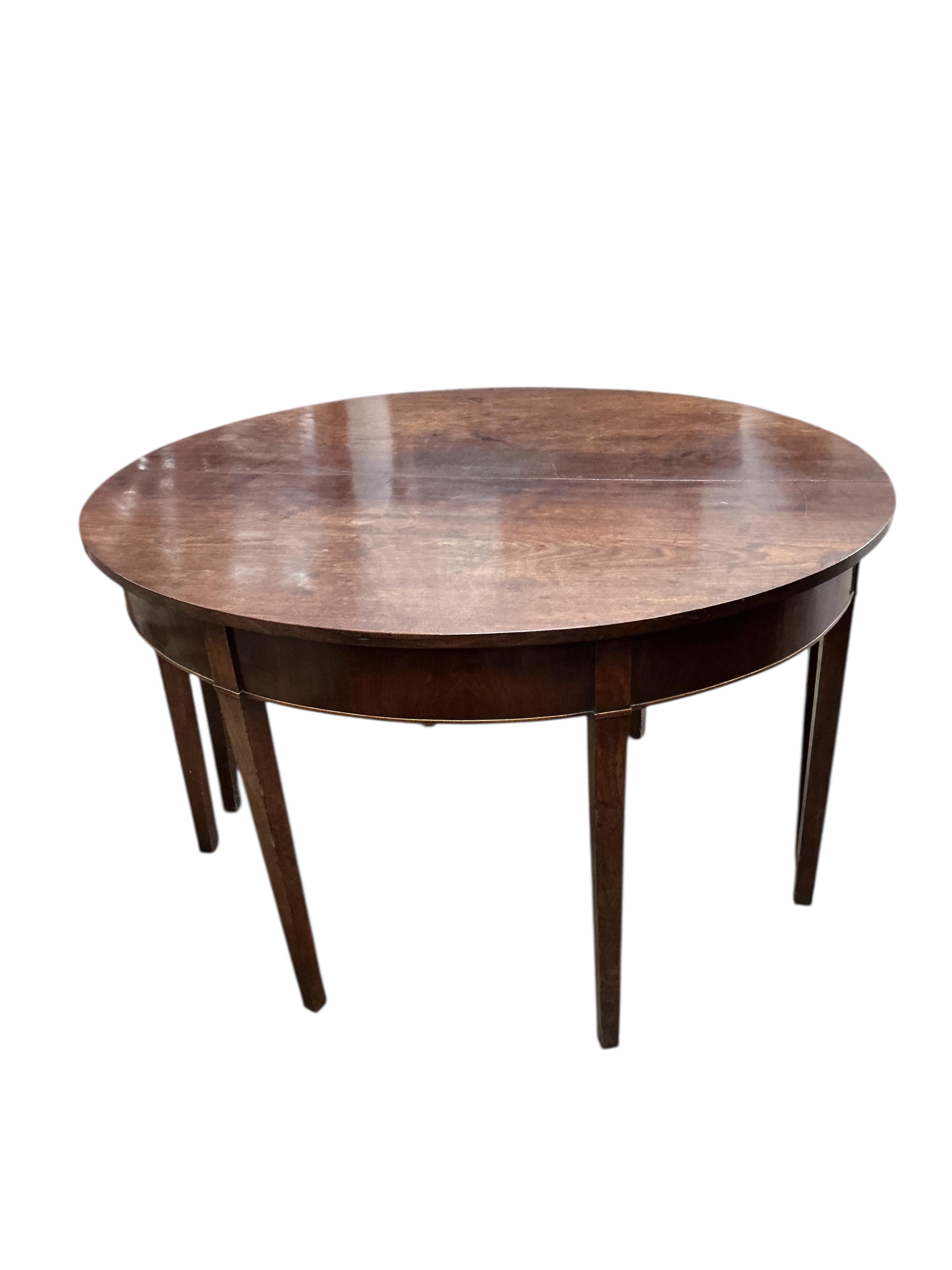 A George III mahogany D end extending dining table, width 194cm extended, two spare leaves , depth 118cm, height 73cm (no clips)